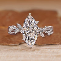 Marquise cut diamond ring hidden halo style.