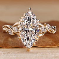 Marquise cut diamond ring with marquise side stones.