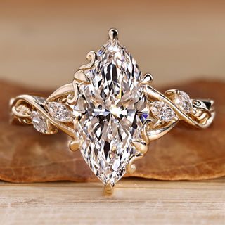 Marquise cut diamond ring with marquise side stones.