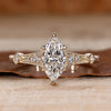 Marquise cut diamond ring vintage round side stones.