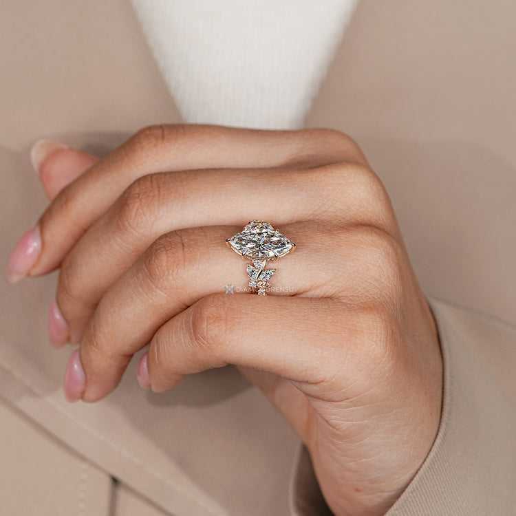 Lab grown marquise diamond ring with side stones.