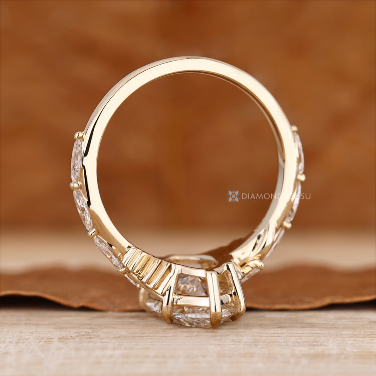 Marquise ring shared prong pave leaf style