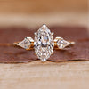 Three stone diamond ring with marquise centre stone.

