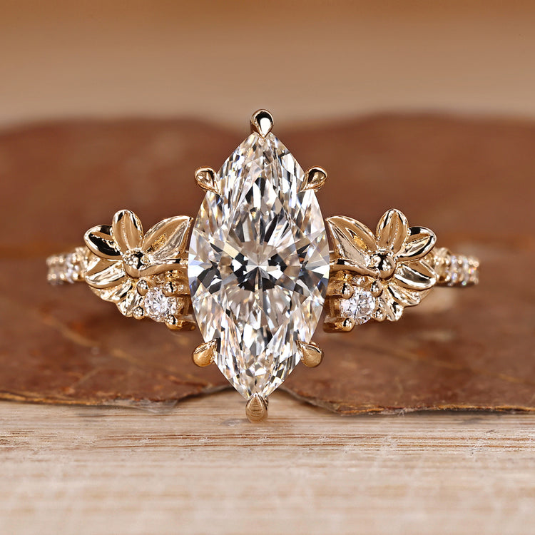 Marquise diamond ring pave round diamond nature style.