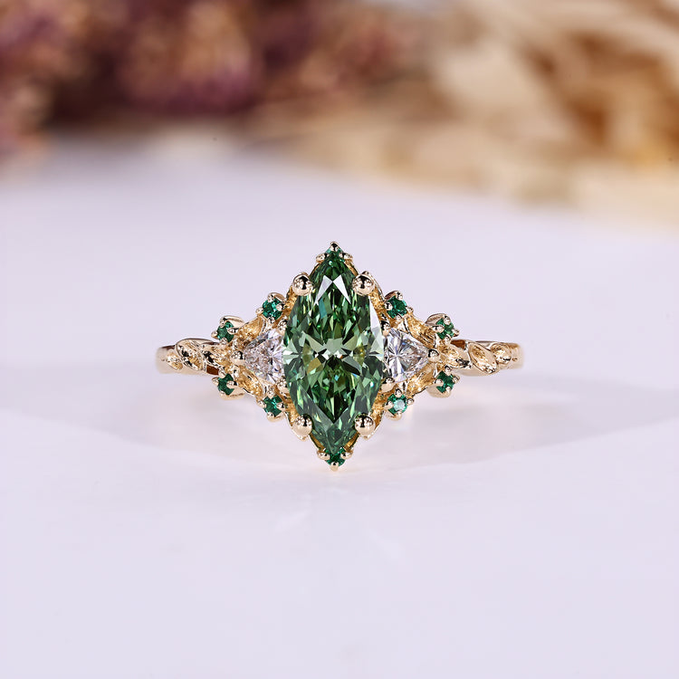 Marquise cut diamond ring trillion side stones.