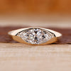 Flush diamond engagement ring with marquise diamond centre.
