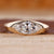 Flush diamond engagement ring with marquise diamond centre.