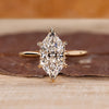 Dutch marquise ring with round diamond hidden halo.

