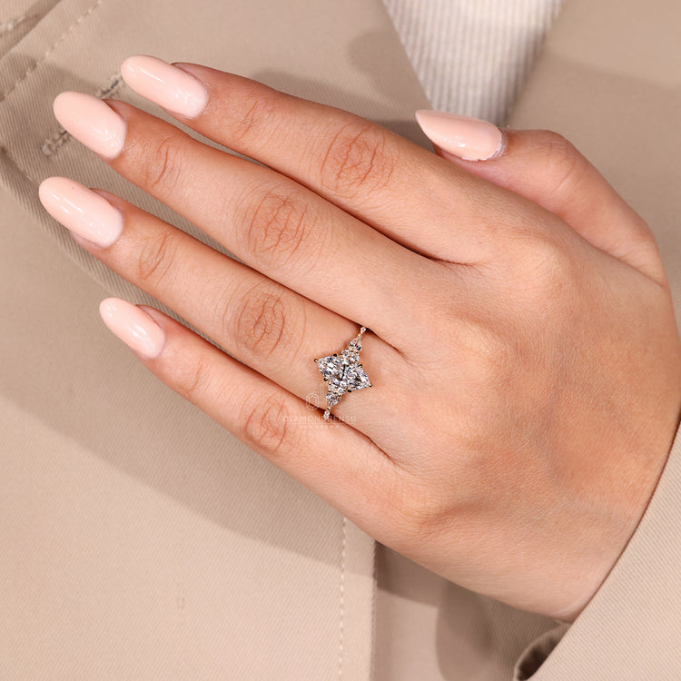 Marquise diamond ring with six claw prong setting.

