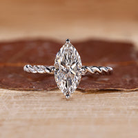 Marquise diamond ring solitaire compass prong twisted.
