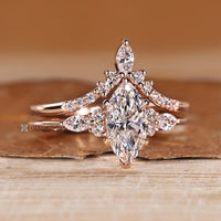 Marquise bridal set with curved diamond wedding band.