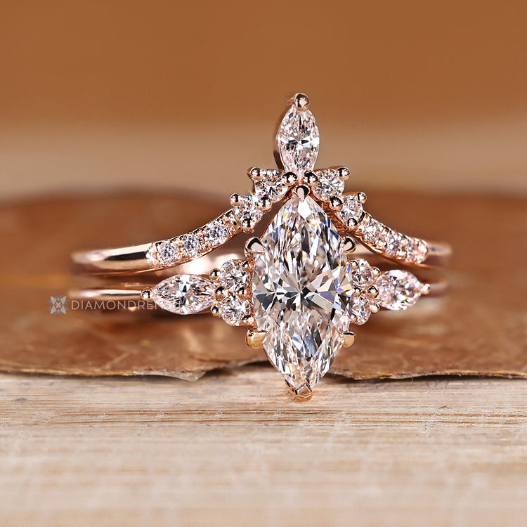 Marquise bridal set with curved diamond wedding band.