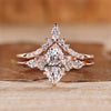Marquise diamond bridal set with round and marquise side stones.