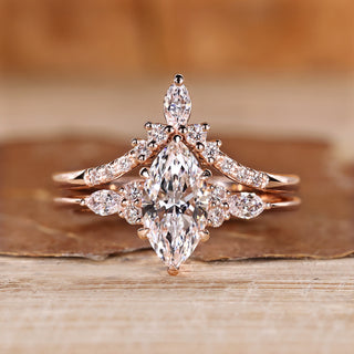 Marquise diamond bridal set with round and marquise side stones.
