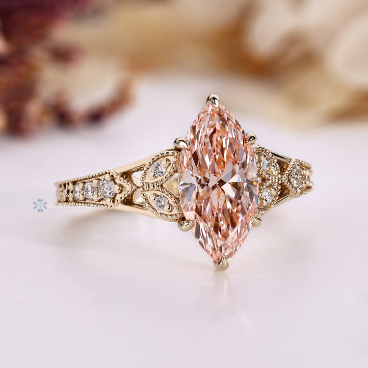 Art Deco marquise diamond ring with round stones.