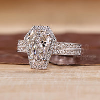 Coffin cut ring milgrain double row pave halo style.
