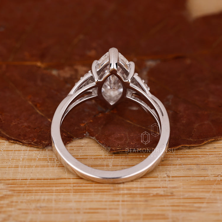 Seven stone diamond ring in cathedral setting.
