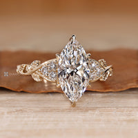 Nature inspired marquise diamond ring leaf design.