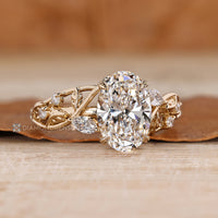 Nature inspired oval diamond ring leaf design.