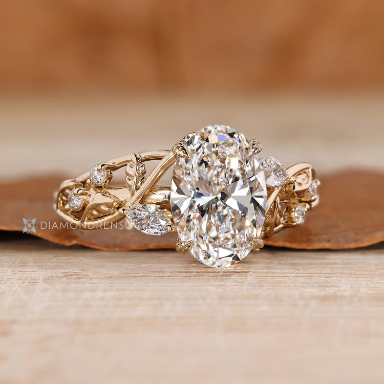 Nature inspired oval diamond ring leaf design.