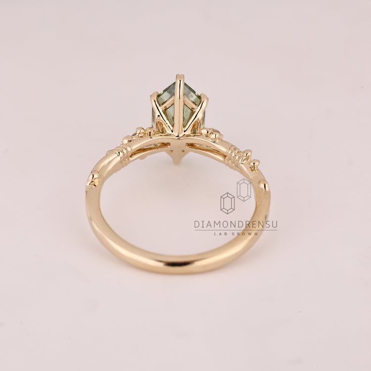 Art deco marquise diamond ring with nature inspired leaf prongs.