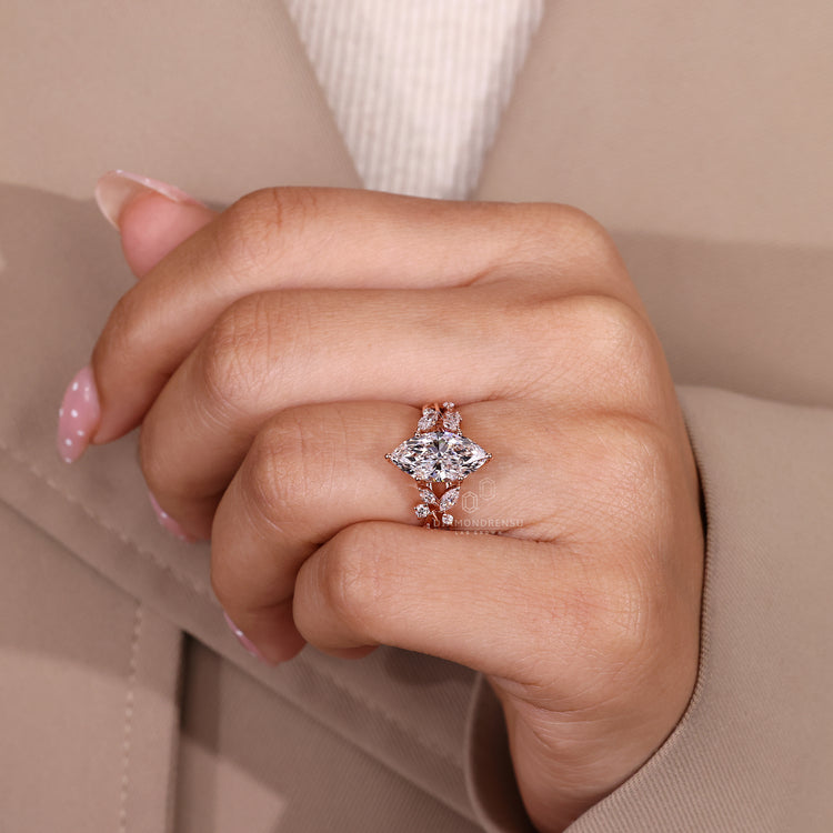 Marquise ring marquise side stones prong setting.
