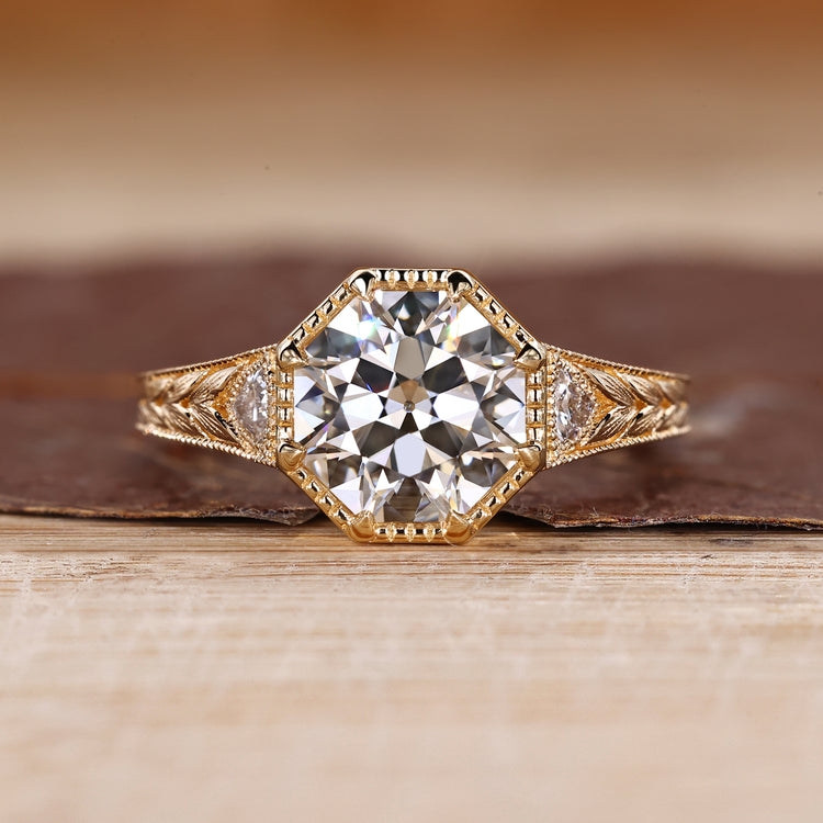 Octagon Old European Cut Ring with trillion side stones.
