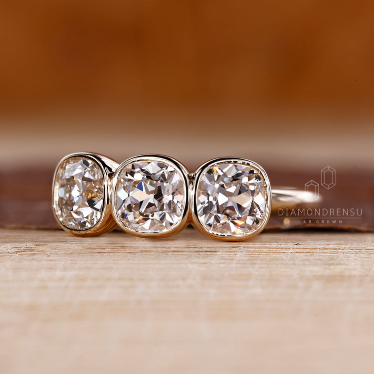 Three stone Cushion Old European Cut Lab Grown Diamond ring.
