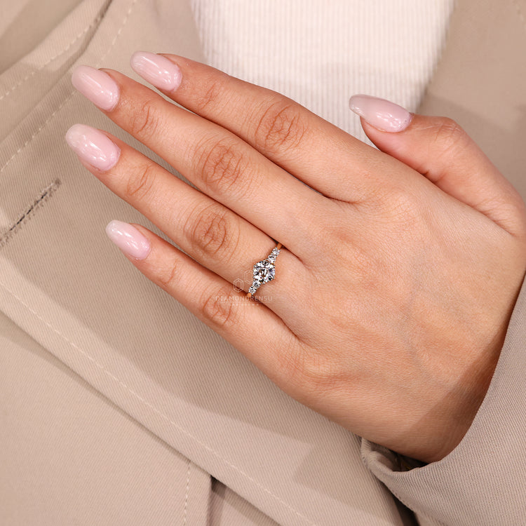 Handmade round old cut ring five stone side stones.
