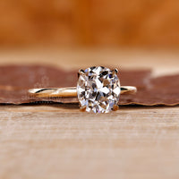 Lab grown cushion old cut ring solitaire four claw set.