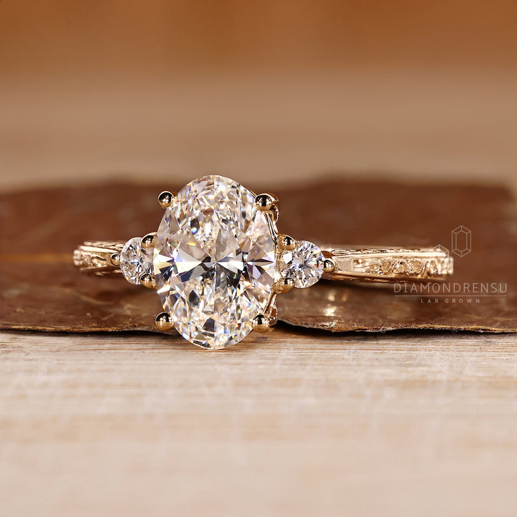 Lab grown oval diamond ring art deco three stone.
