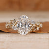 Oval diamond ring nature inspired leaf detailing.
