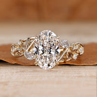 Oval diamond ring nature inspired leaf detailing.