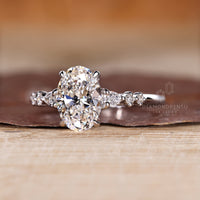 Seven stone oval diamond ring pear round side stones.
