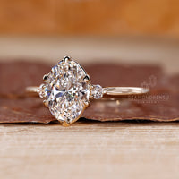 Three stone oval diamond ring cathedral tapered shank.
