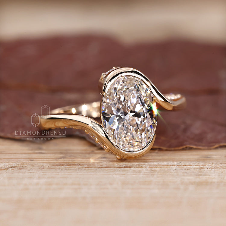 Oval diamond ring bypass setting hidden pave style.