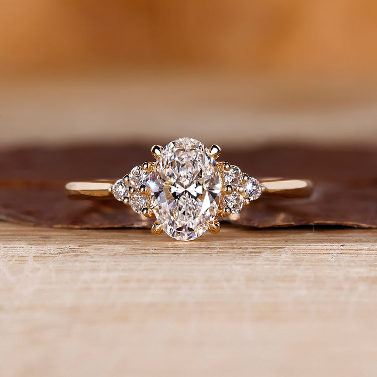 Oval cut diamond ring seven stone muse cathedral set.
