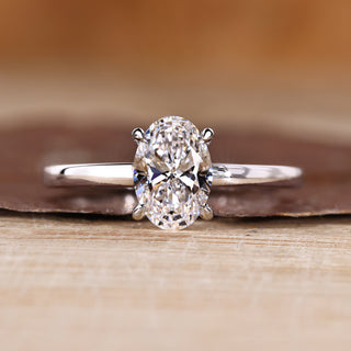 Oval diamond engagement ring hidden halo four claw.