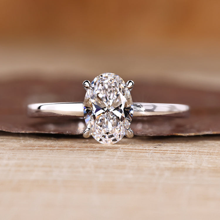 Oval diamond engagement ring hidden halo four claw.