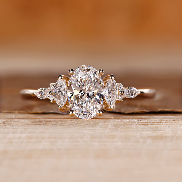 Oval cut diamond ring marquise round muse tapered shank.
