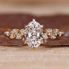 Oval cut diamond ring round side stones cluster vintage.