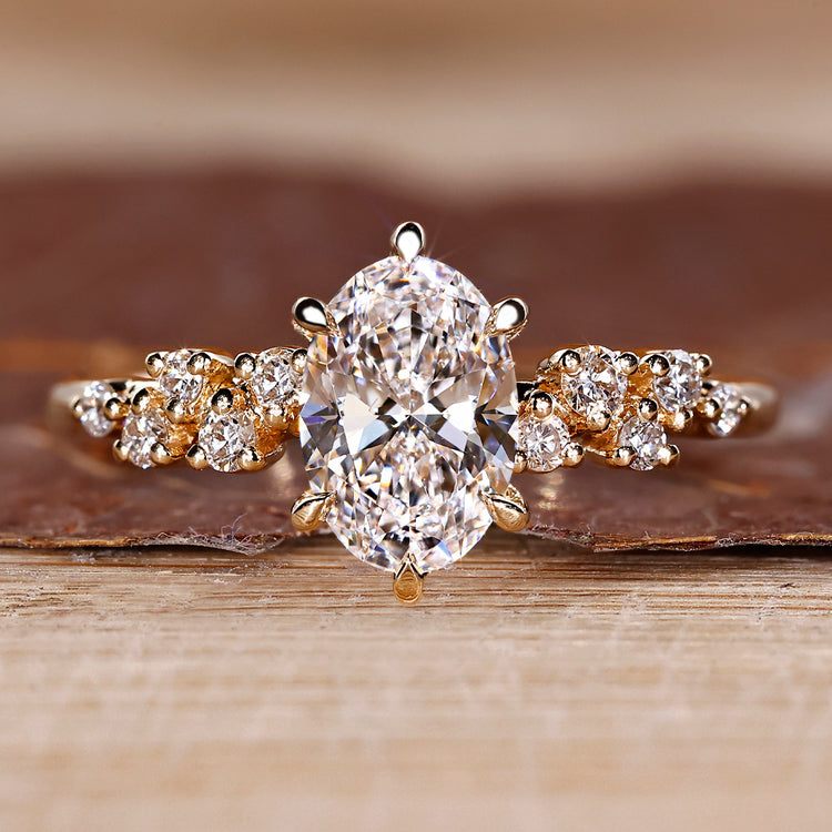 Oval cut diamond ring round side stones cluster vintage.