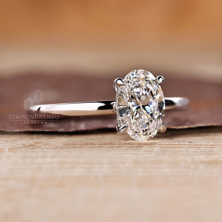 Lab grown oval engagement ring hidden halo style.