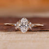 Oval cut diamond ring with round cut side stones.
