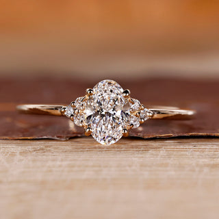 Oval cut diamond ring with round cut side stones.
