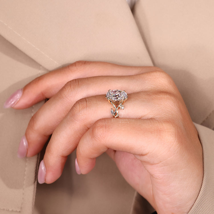 Oval cut ring leaf prong twisted shank setting.
