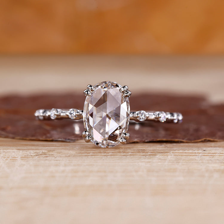 Oval rose cut diamond ring with round hidden stone detail.
