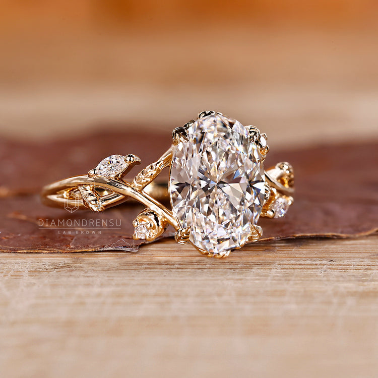 Nature inspired oval diamond ring cluster style.
