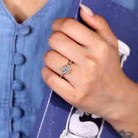 Oval cut ring art deco three stone four prong set.
