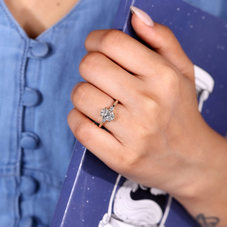 Oval cut ring art deco three stone four prong set.

